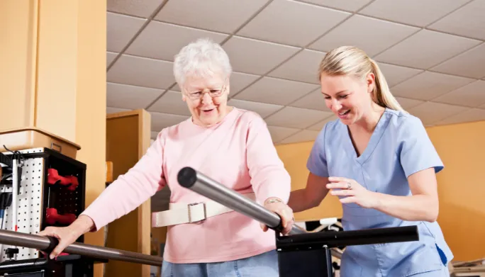 Therapist guiding a patient through balance and gait training