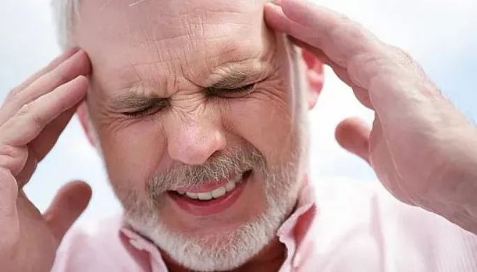 Therapist treating the neck to relieve a patient's headaches