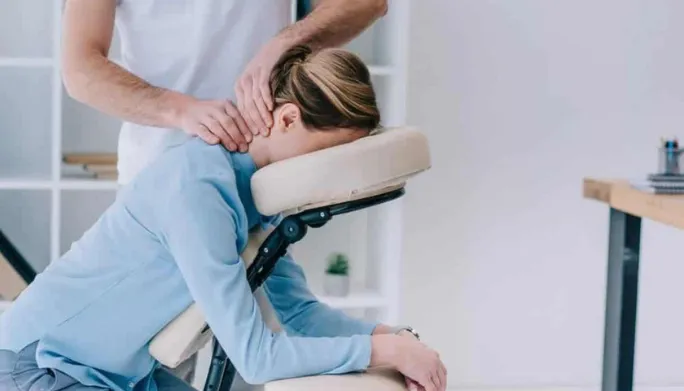 Therapist treating a patient's neck pain