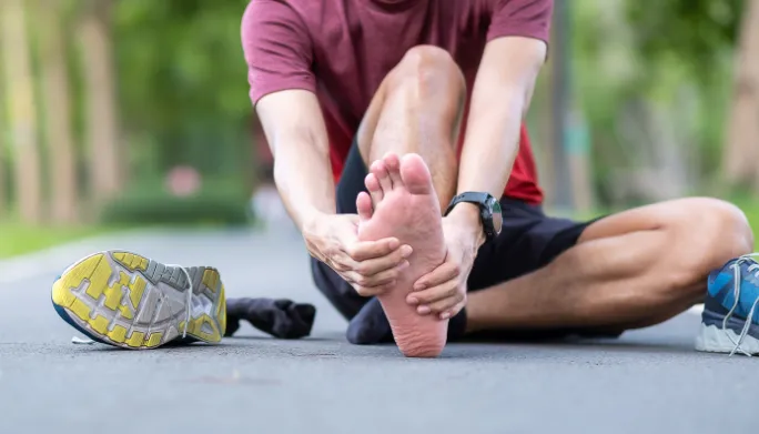 Therapist treating a patient's heel and arch pain