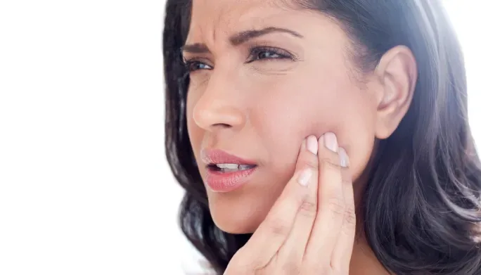 Therapist treating a patient's jaw pain