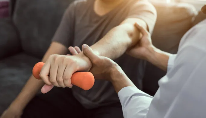 Physical therapist providing in-home treatment
